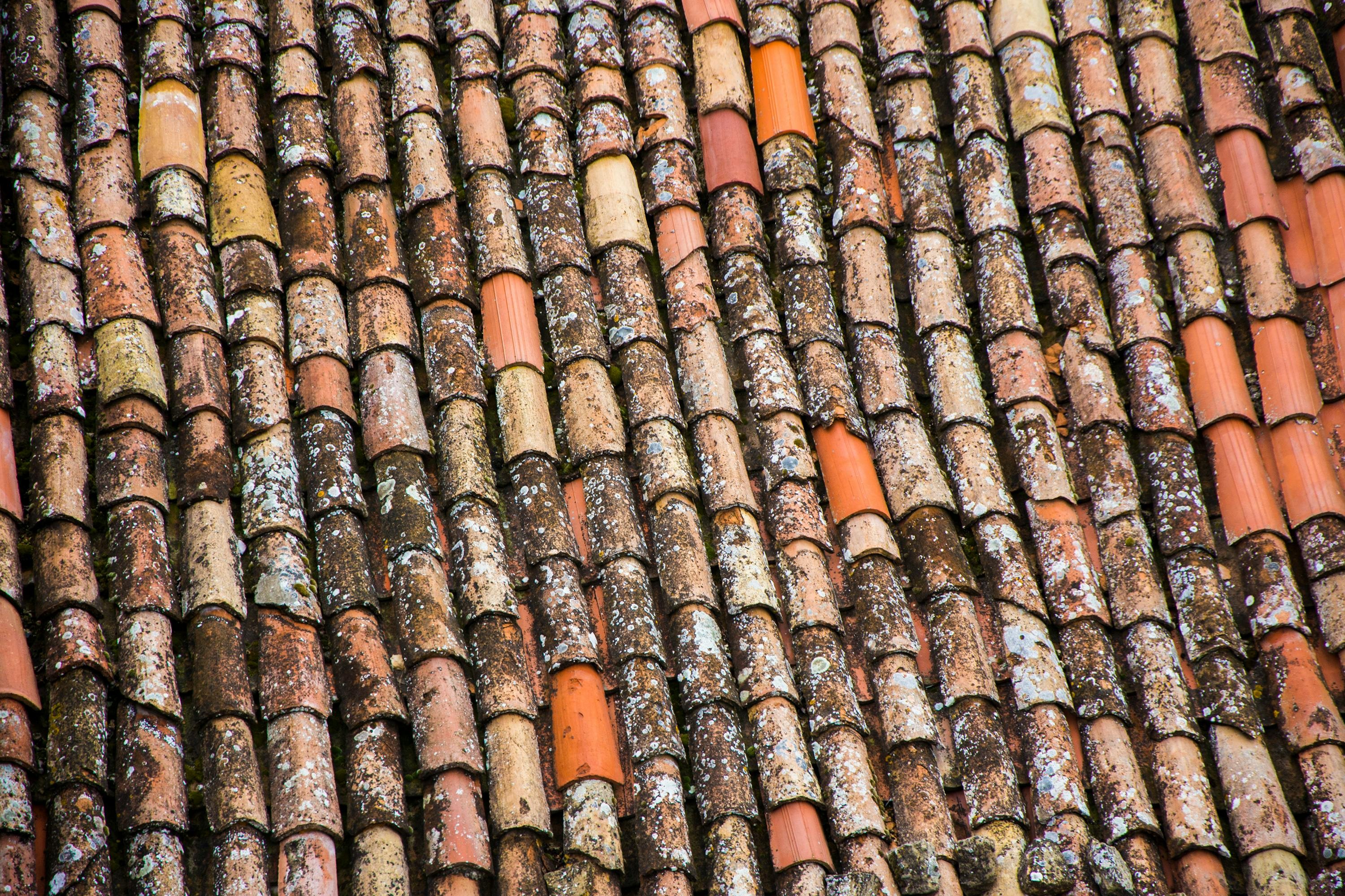 Close-up of professional roof tile installation