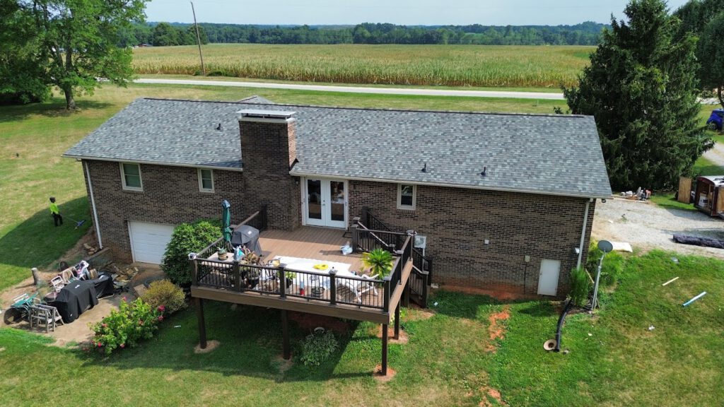 Professional roofers working on a residential roof installation